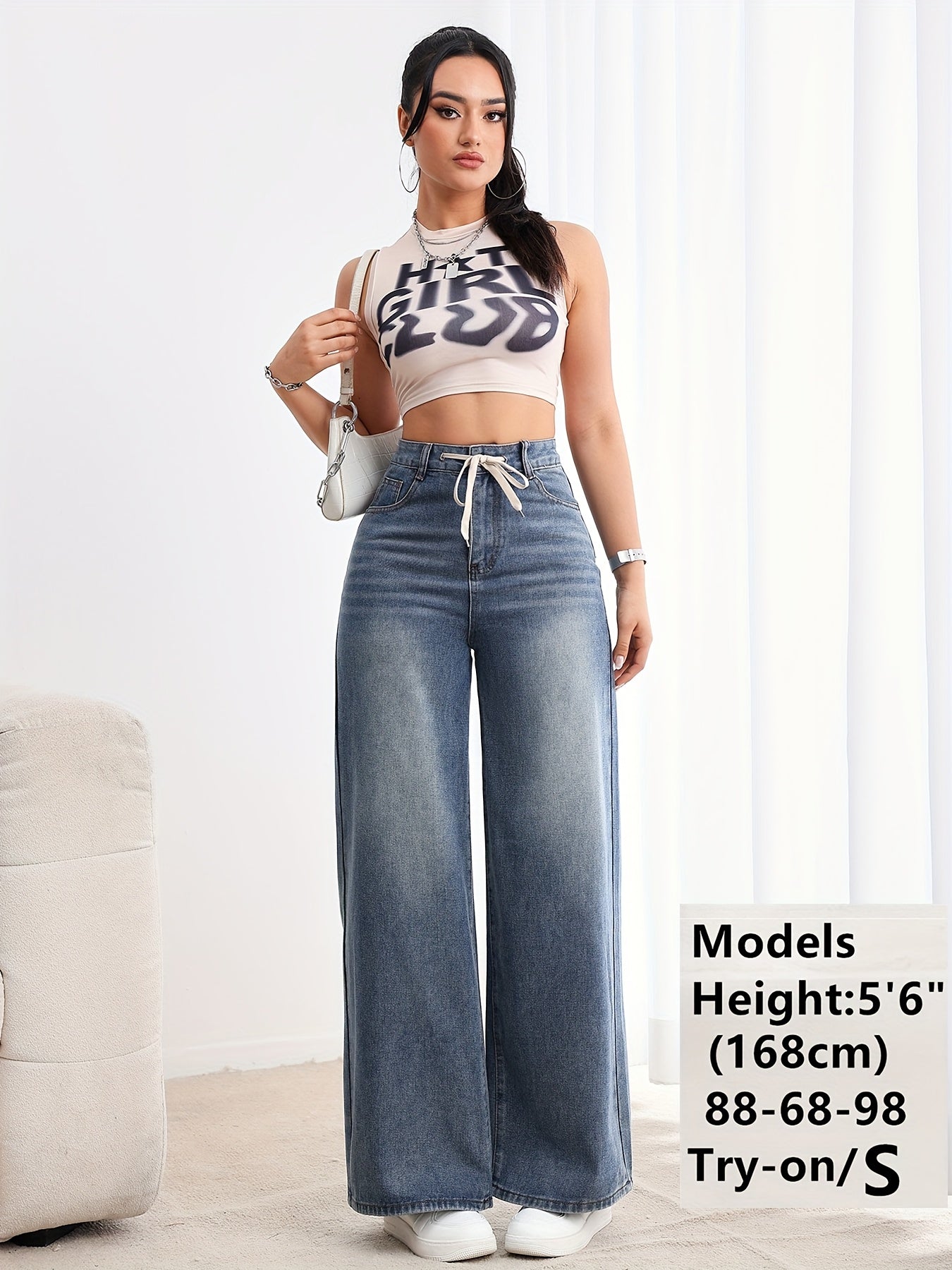 Pantalon en jean pour femme, taille haute et jambes larges ,effet délavé avec cordon de serrage à la taille (Disponible en plusieurs tailles de XS à XXL)