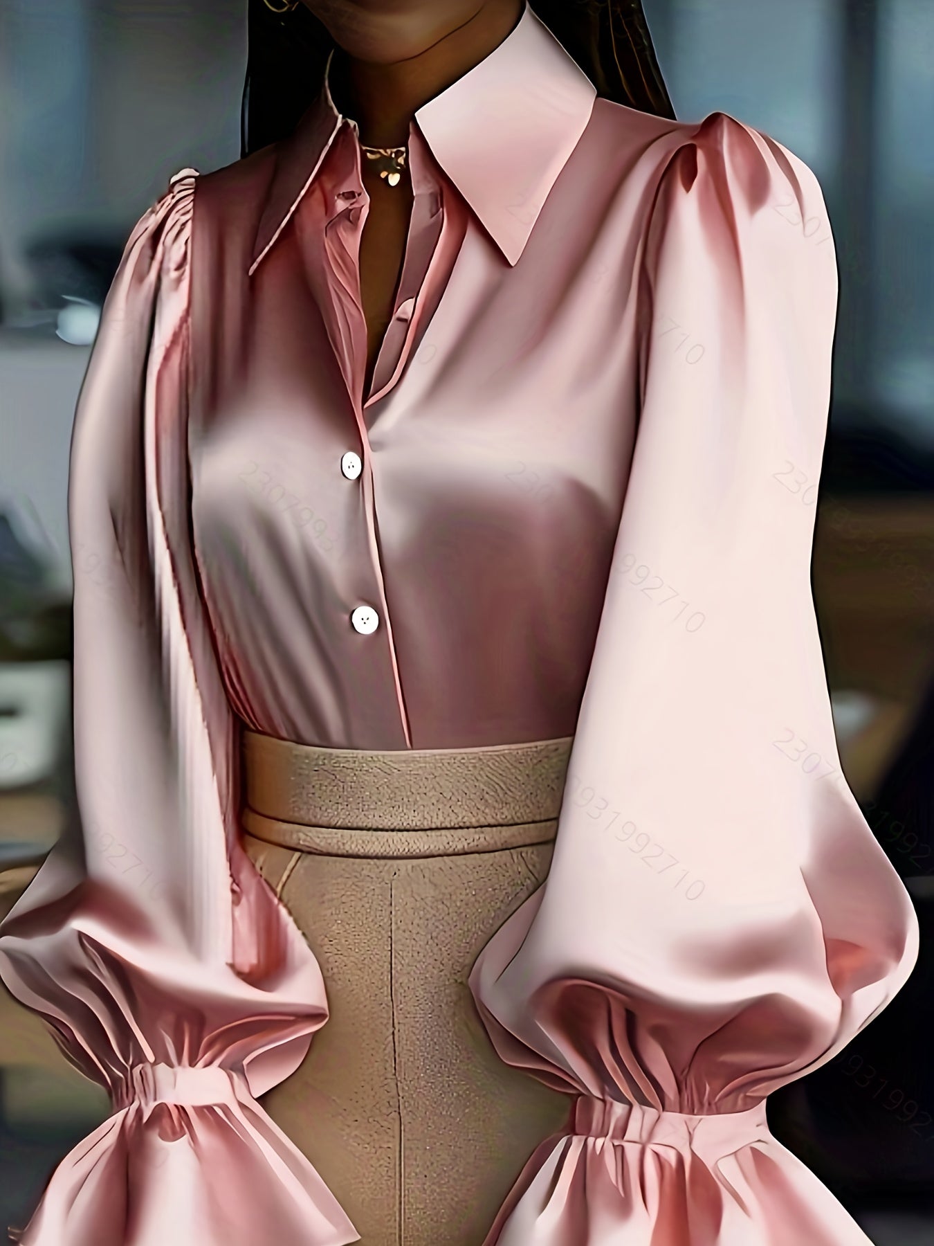 Chemise élégante et pleine de tempérament en satin et crêpe satinée à manches lanternes bouffantes.