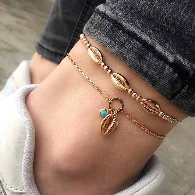 Ensemble de 4 pièces de bracelets de cheville en coquillage pour femmes.