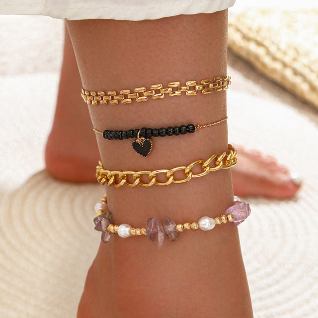 Ensemble de 4 pièces de bracelets de cheville en coquillage pour femmes.